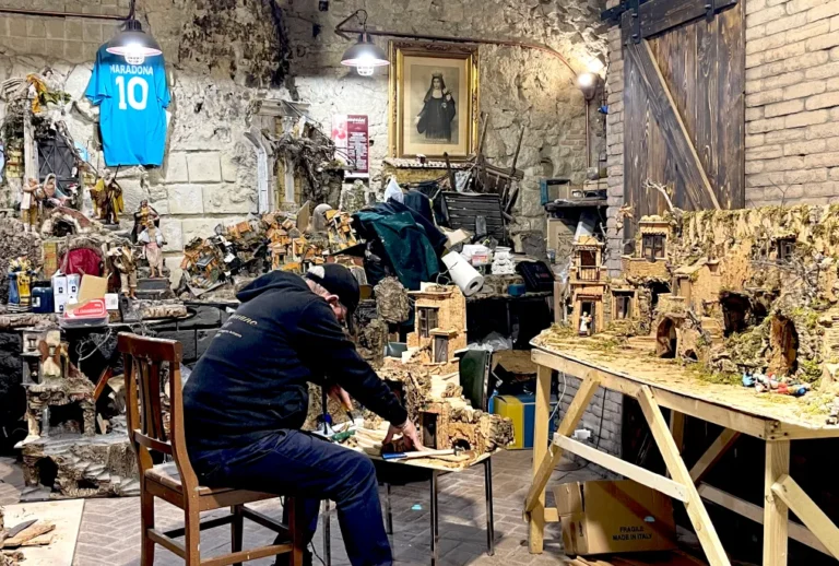 Neapolitan artisan crafting handmade nativity scene