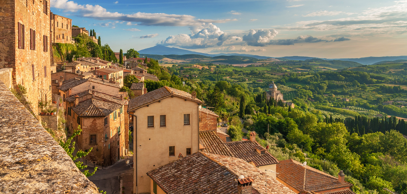 The charming city of Montepulciano is spread out along the ridge of a hillside, overlooking hectares of vineyards, the very same that produce the renowned red wine Vino Nobile.